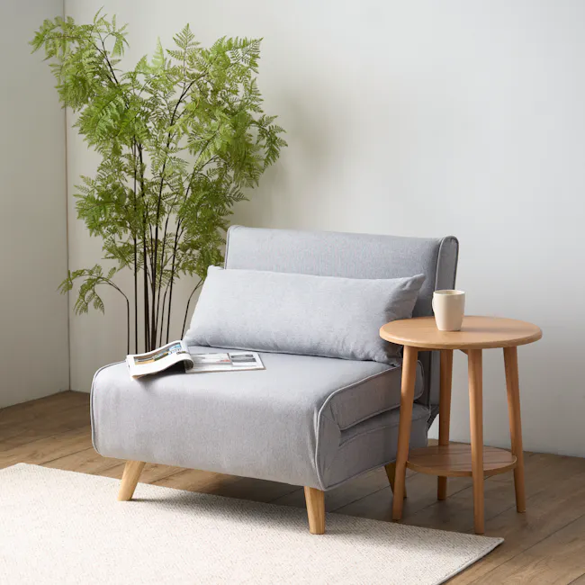 Noel Sofa Bed - Harbour Grey - 6 - Light gray sofa, wooden legs, light beige rug, light gray cushion, wooden armrest, round