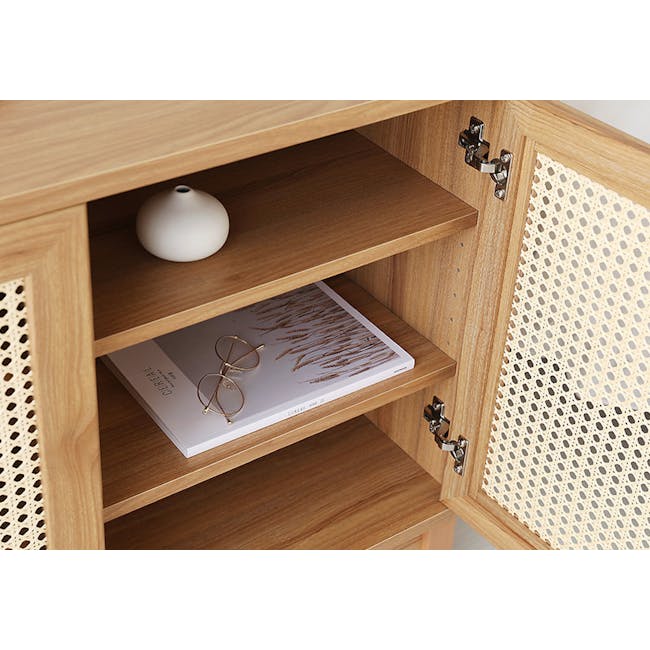 Belig Rattan Sideboard 1.3m - 10 - Wooden cabinet with open shelves, white vase on the top shelf, magazine on the middle