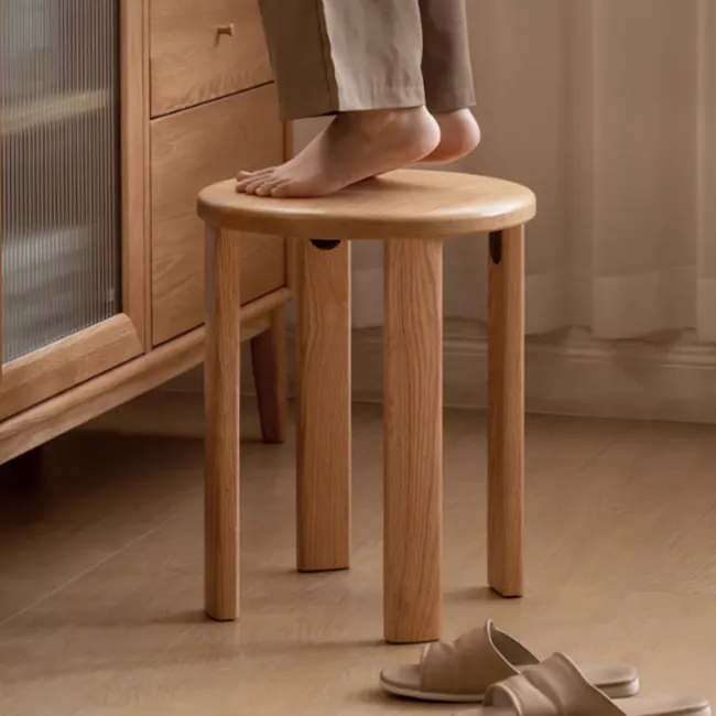Coree Stackable Stool Set / Side Table - Oak - 3 - Wooden stool, light brown finish, minimalist design, person standing