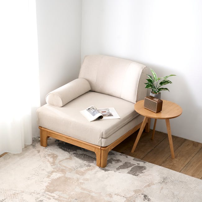Zara Sofa Bed - Gravel White - 14 - Cream-colored sofa, minimalist decor, natural light streaming in, wooden armrests, soft