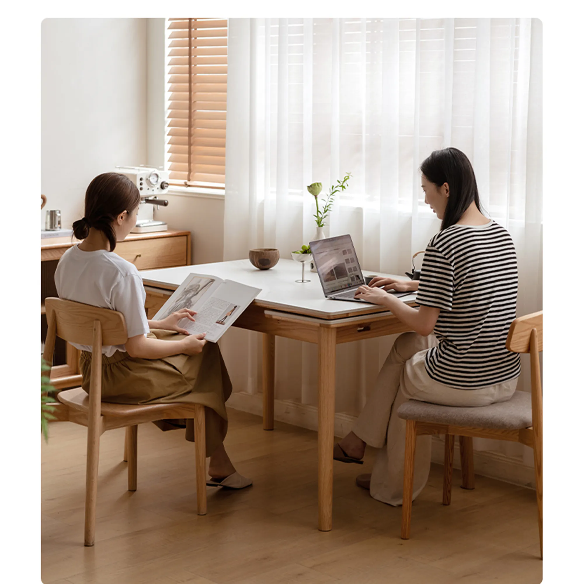 Fidela Extendable Dining Table 1.25-1.95m (Sintered Stone) - 17 - Two women sitting at a wooden table in a cozy room., One
