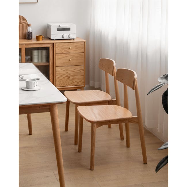 Solis Dining Chair - Oak - 9 - Wooden dining table, minimalist design, light wood chairs, natural light, white marble top