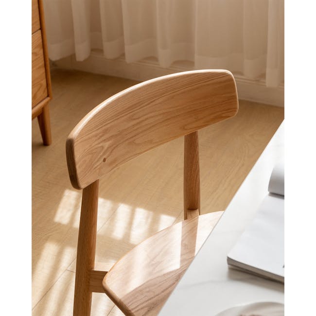 Solis Dining Chair - Oak - 8 - Wooden chair, natural wood finish, minimalist design, soft lighting, sunlight filtering