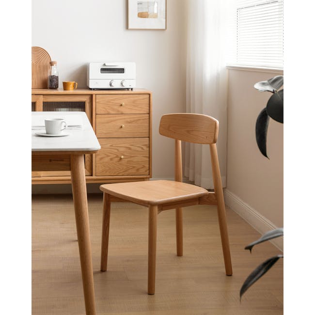 Solis Dining Chair - Oak - 7 - Wooden dining table, minimalist design, wooden chair, natural light, white coffee cup, wooden