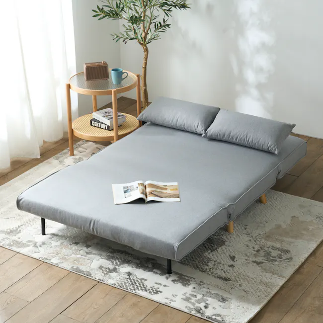 Noel 2 Seater Sofa Bed - Harbour Grey - 4 - Modern minimalist bedroom, cozy seating area, light gray sofa, wooden legs, soft
