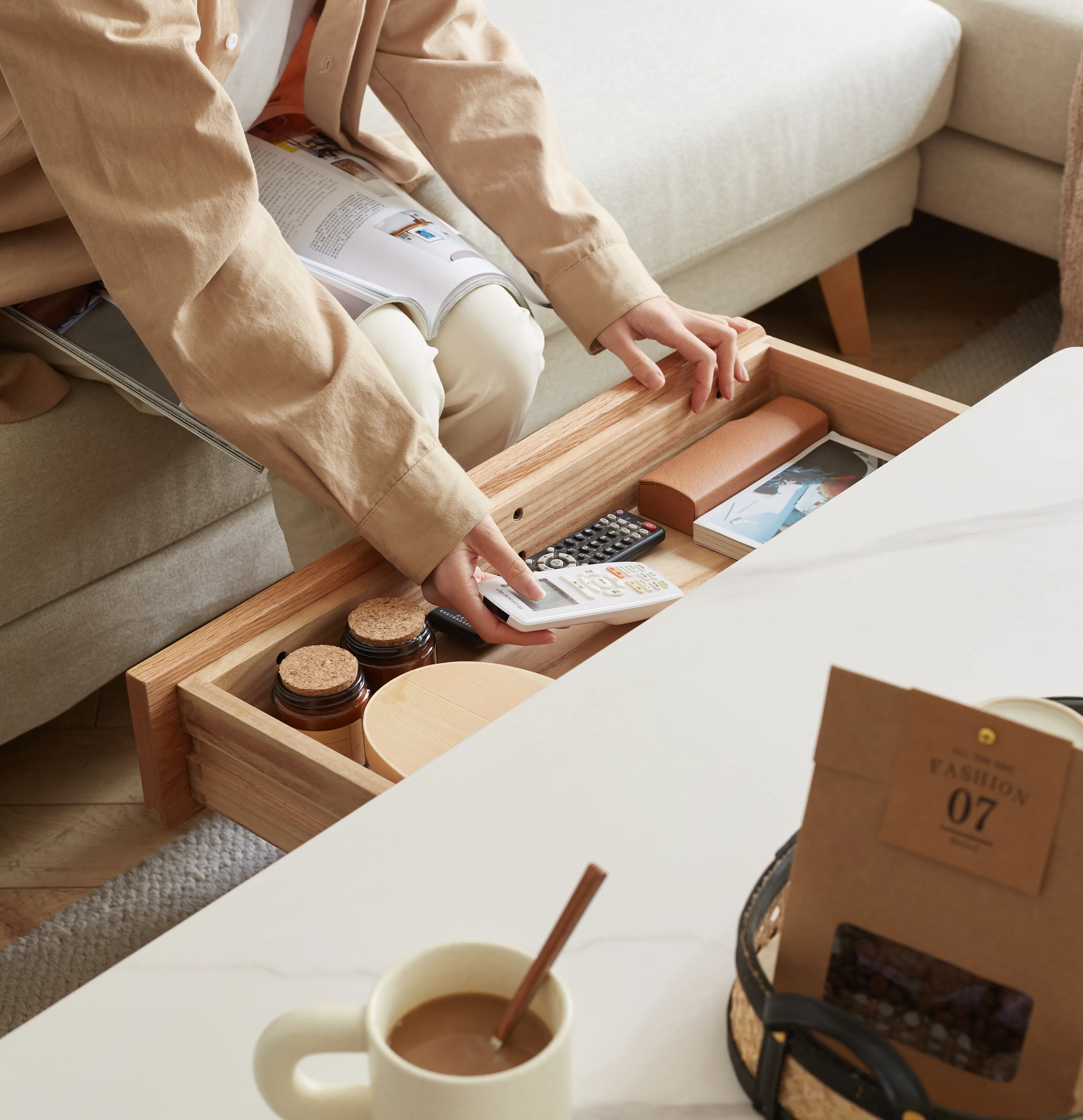 Devin Coffee Table 1m (Sintered Stone) - 12 - Soft beige jacket, wooden drawer, open drawer, beige sofa, wooden floor, white