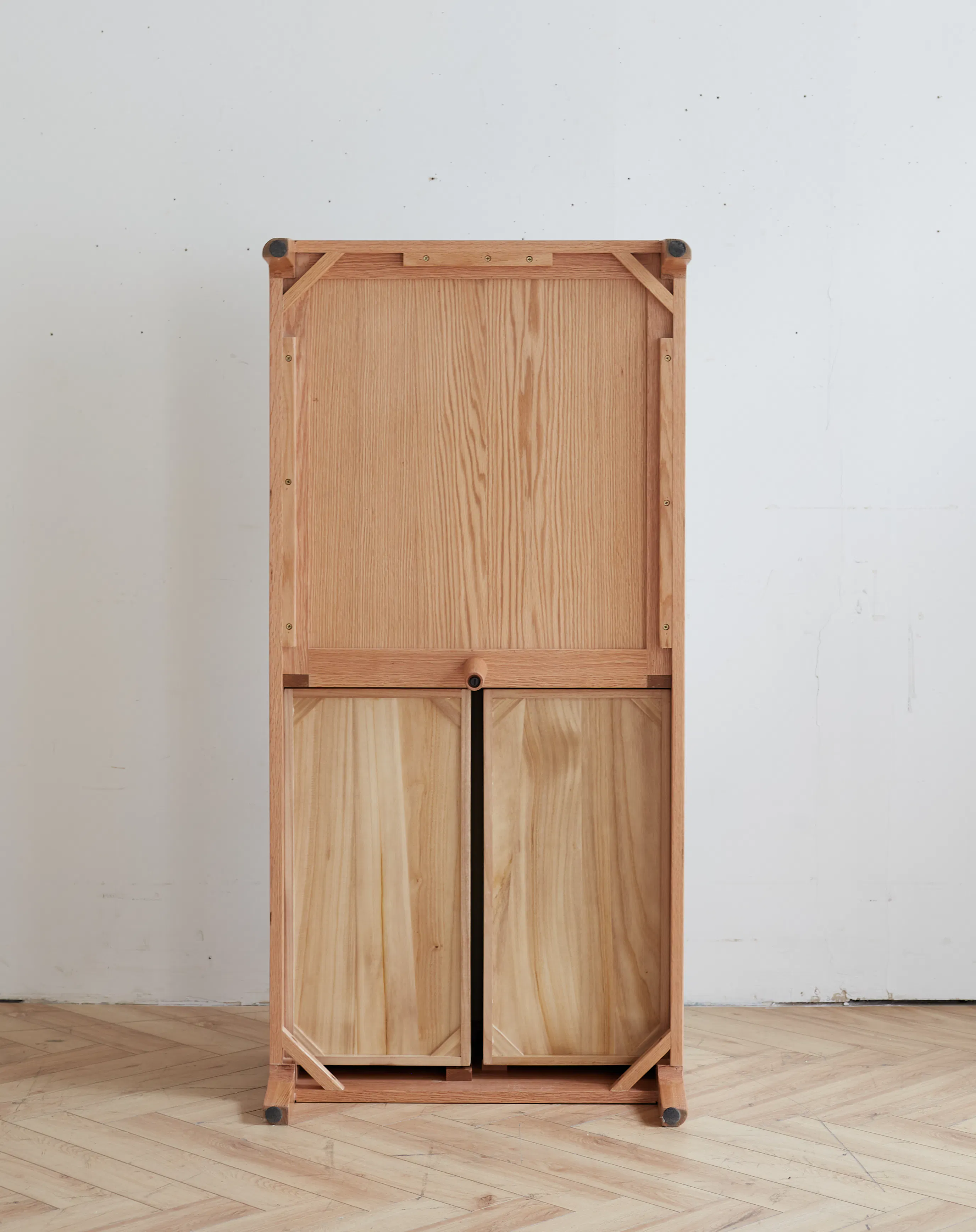 Devin Coffee Table 1m (Sintered Stone) - 11 - Wooden cabinet with metal hinges, light wooden floor, wooden wall, wooden door