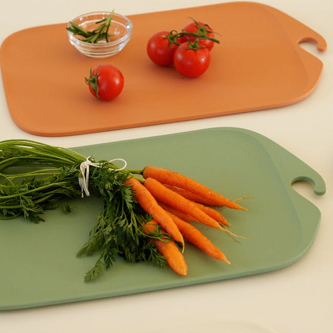 Modori Cutting Board - Navy - 7 - Fresh green herbs, vibrant orange carrots, small cherry tomatoes, green leafy vegetables