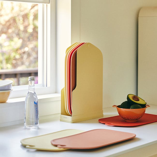 Modori Cutting Board - Navy - 5 - Organized kitchen corner, beige file organizer, colorful paper plates, clear bottle of