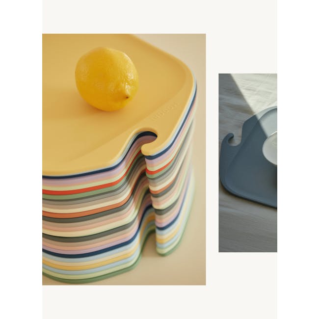 Modori Cutting Board - Navy - 3 - Yellow wavy plate, colorful layered plates, lemon on yellow plate, stack of multicolored