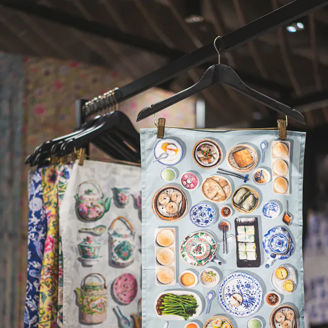 Singlapa Chinese Dim Sum Tea Towel - 2 - Traditional Asian cuisine, colorful fabrics, patterned tea sets, various dishes