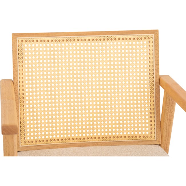 Kiki Rattan Lounge Chair - 7 - Wooden chair with woven backrest, light beige color, natural wood finish, intricate lattice