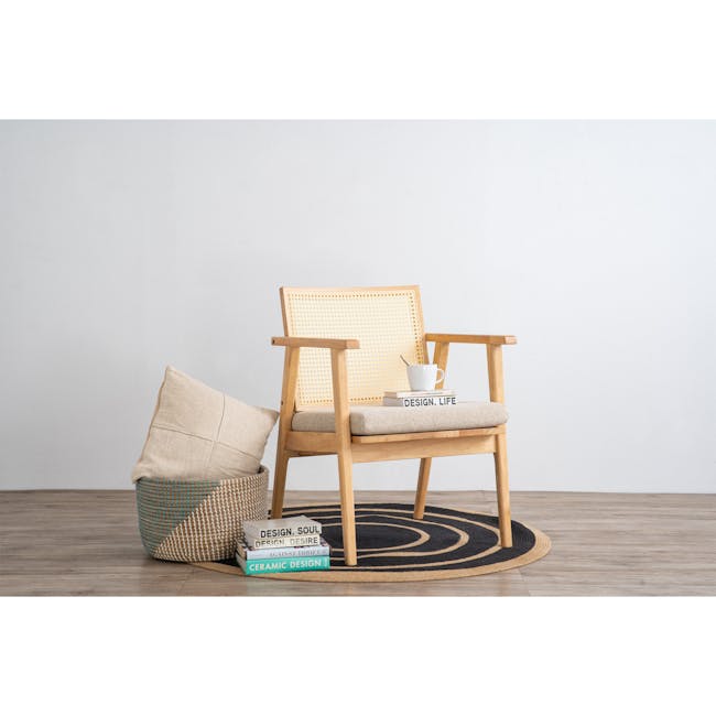 Kiki Rattan Lounge Chair - 2 - Wooden chair, beige cushion, woven seat, round rug, minimalist design, natural wood finish