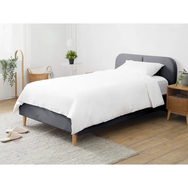 Nolan Single Bed - Hailstorm - 2 - White and gray bed with wooden legs, white and gray pillows, white and gray comforter