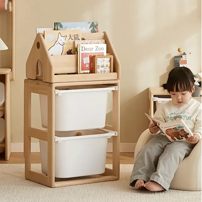 Micah Wooden Kids House Book Organiser - 3 - Wooden children's reading stand with built-in bins, child sitting on a