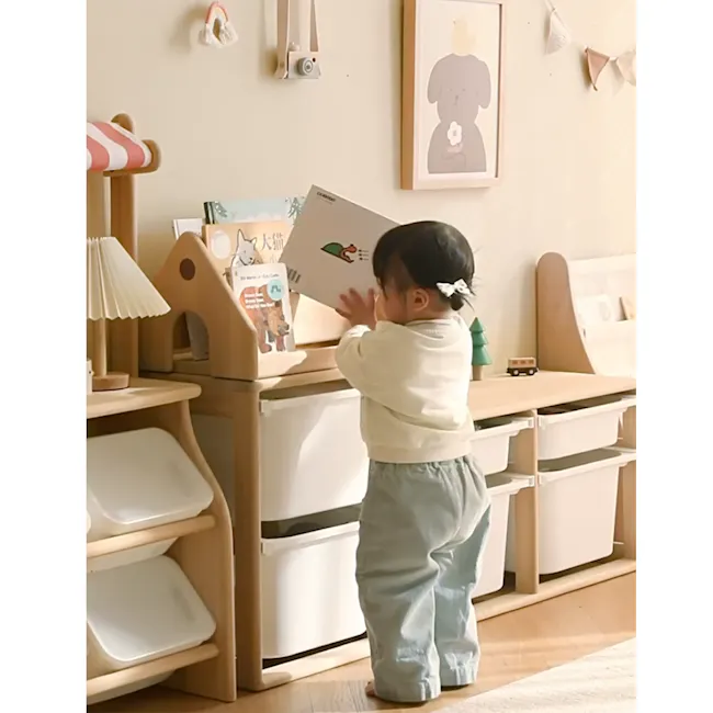 Micah Wooden Kids House Book Organiser - 7 - Soft pastel room, cozy corner, baby standing, toddler exploring, wooden