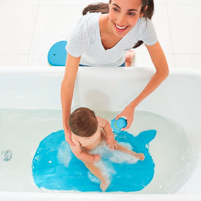 Skip Hop Moby Bath Mat - Blue - 3 - Woman smiling, baby in bathtub, blue water, bubble bath, adult and child, bath time