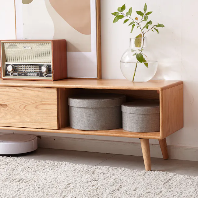Beau TV Console 1.5m - Oak - 6 - Vintage radio on wooden cabinet, gray storage bins, modern robotic vacuum cleaner, white
