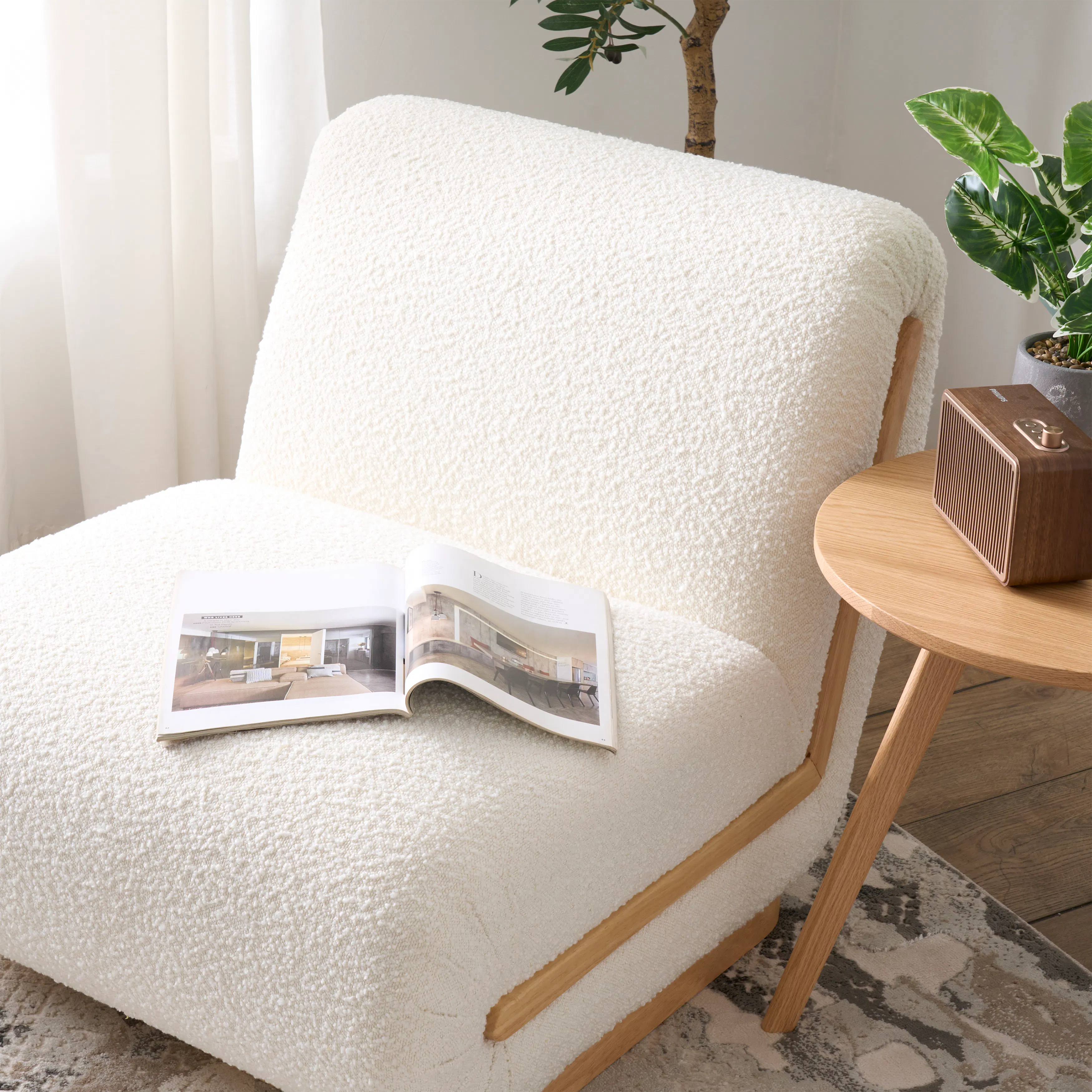 Eloise Lounge Chair - 12 - Cream-colored, plush armchair, soft lighting, natural light streaming through sheer curtains