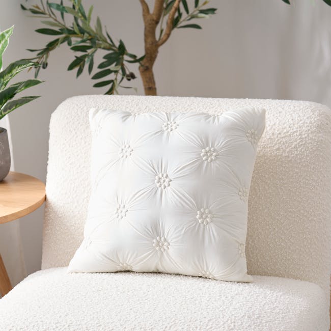 Fione Floral Tufted Cushion - Ivory - 2 - White tufted pillow with floral embellishments, plush armchair, natural light