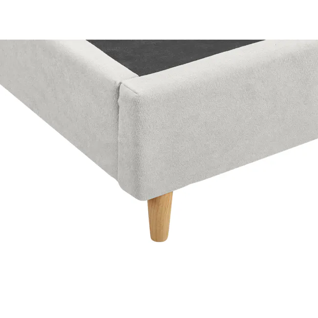 Aspen Super Single Bed - Ice Grey - 7 - Soft-textured, light gray fabric with a pink border, wooden table leg, concrete