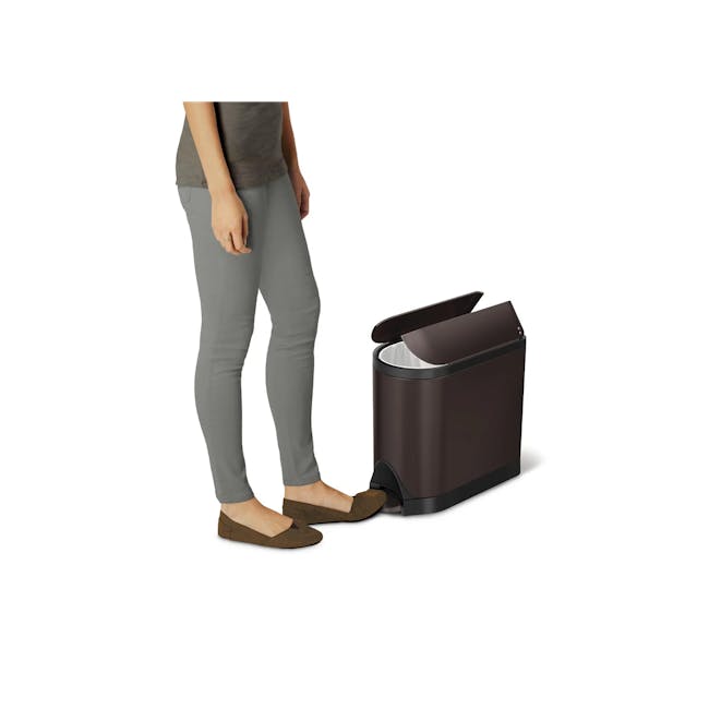simplehuman 10L Butterfly Step Bin - Matte Black - 5 - gray pants, brown shoes, modern trash can, person standing, open lid