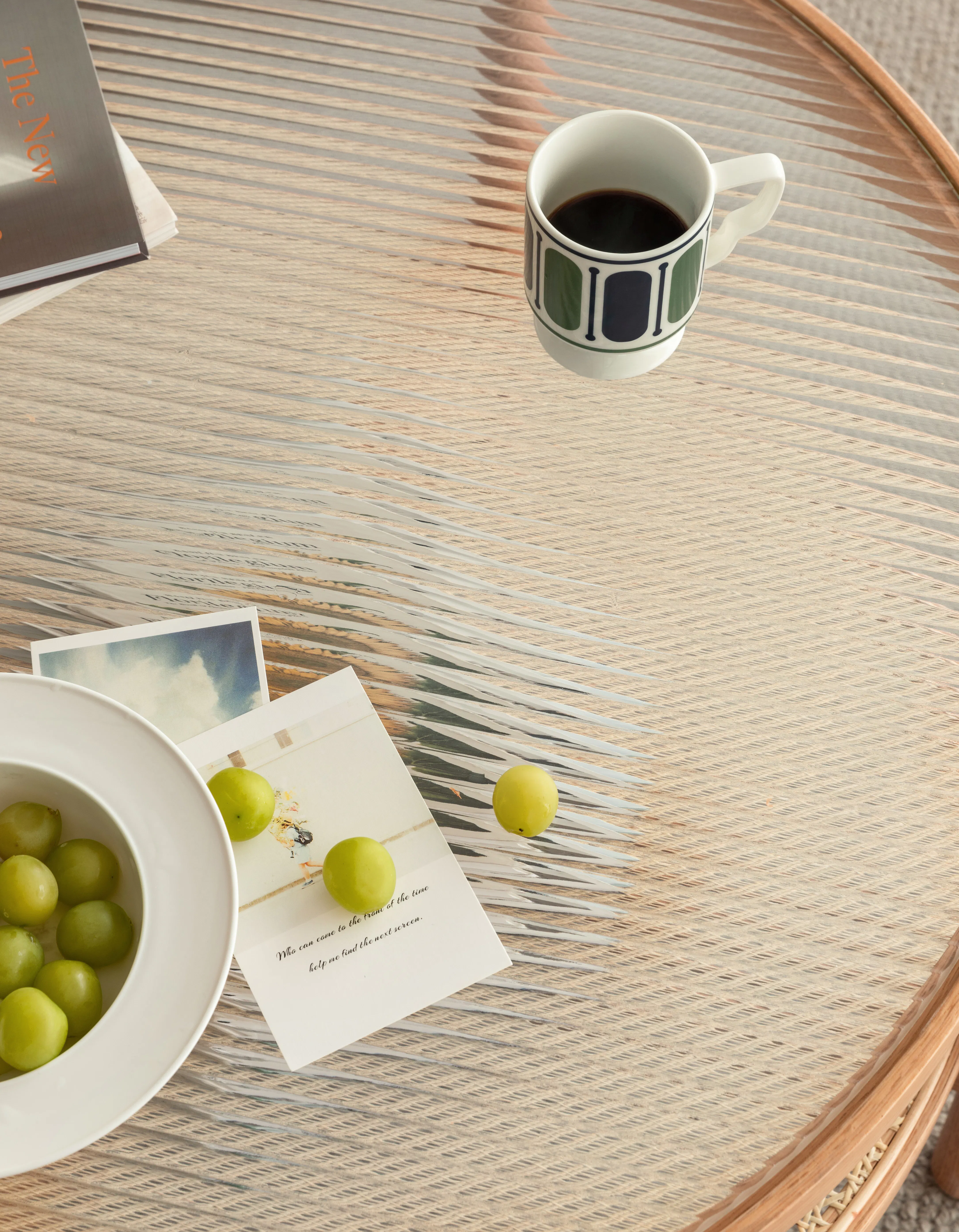 Lilian Rattan Coffee Table - Natural (Glass Tabletop) - 16 - Glass table, green grapes, white bowl, coffee cup, wooden