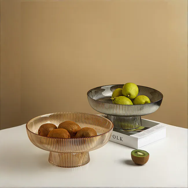 Reagan Glass Display Bowl - Amber - Large - 3 - Golden-rimmed bowl, brown kiwi, green lemons, stacked books, minimalist