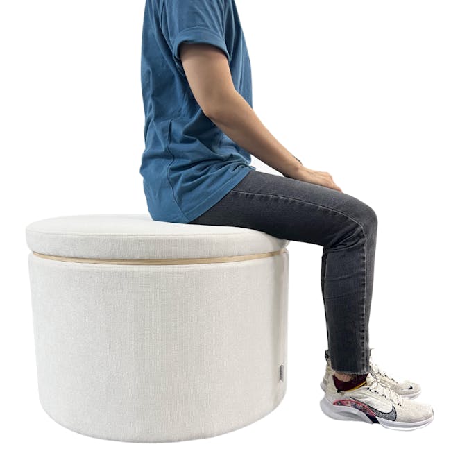 Justin Storage Ottoman - White - 10 - blue shirt, round ottoman, person sitting, jeans, sneakers, modern design, casual