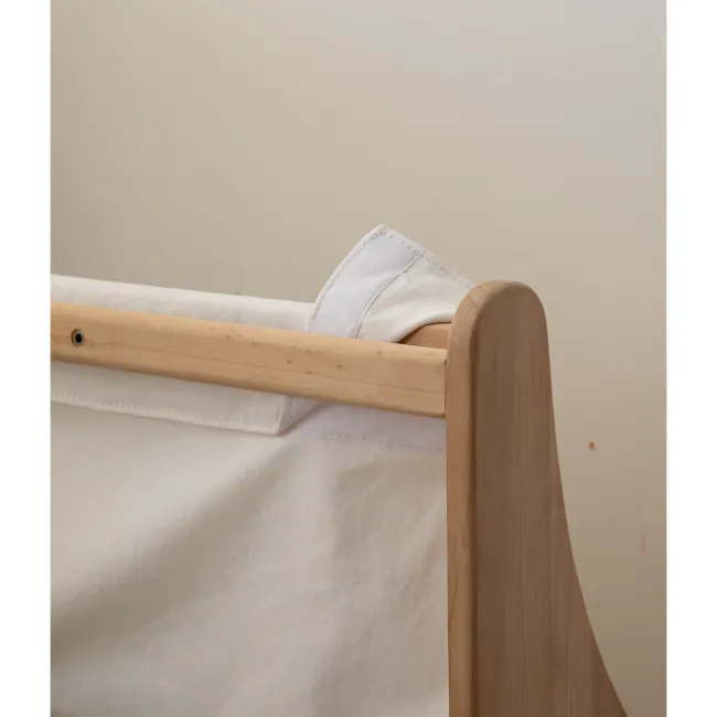 Micah Kids Storage Book Shelf Rack - 6 - Wooden hanger, white fabric, wooden frame, light beige wall, soft lighting