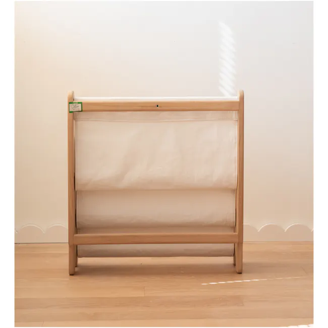Micah Kids Storage Book Shelf Rack - 9 - Wooden crib with soft beige bedding, minimalist design, natural light, wooden