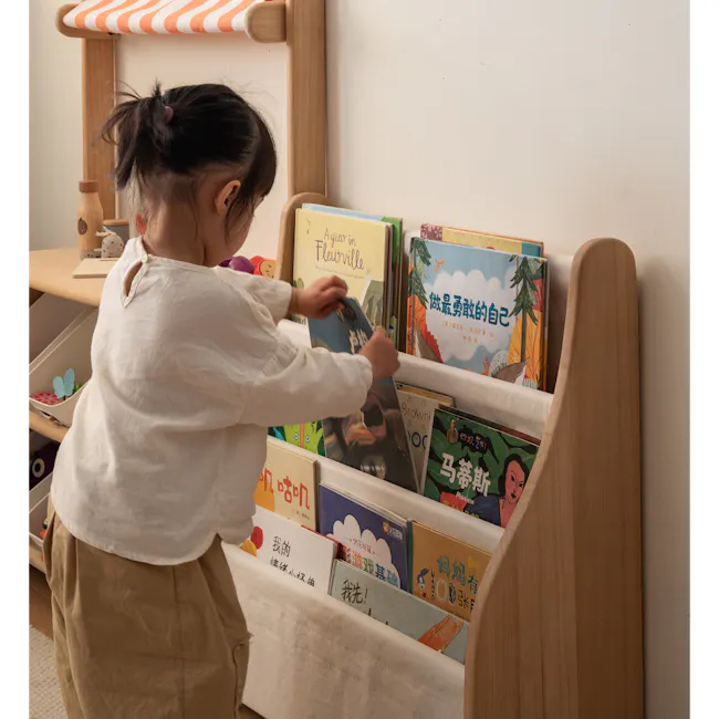 Micah Kids Storage Book Shelf Rack - 4 - Little girl with ponytail, reading book, wooden shelf, colorful books, children's