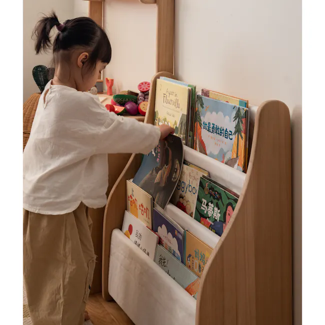 Micah Kids Storage Book Shelf Rack - 13 - young girl with ponytail, reading book, wooden shelf, colorful books, children's