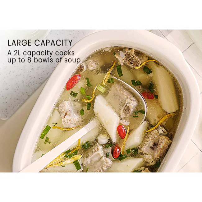 Buydeem 2 Tier Multi Functional Food Steamer - 17 - Large capacity pot filled with soup, ingredients including fish