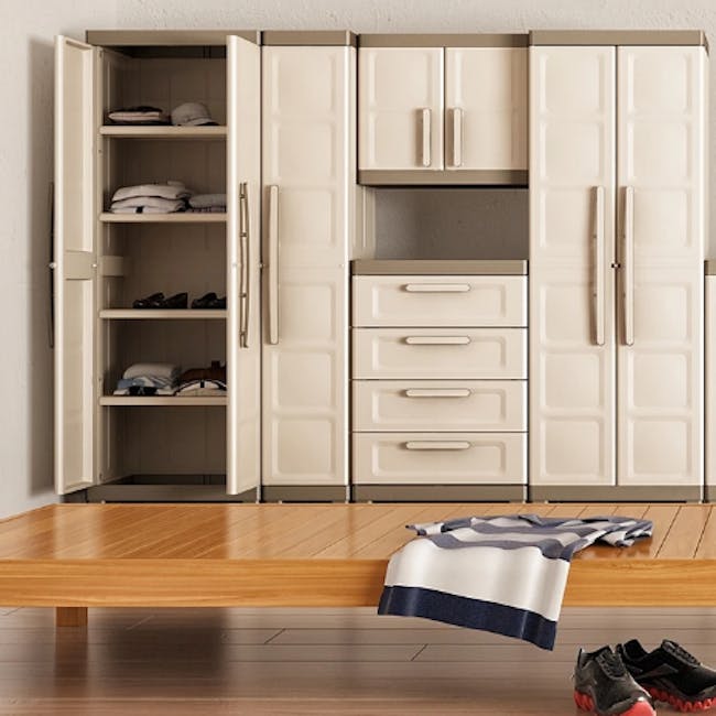 Excellence Utility Cabinet - 3 - White wardrobe with open doors and neatly arranged closet shelves, Wooden table with a blue