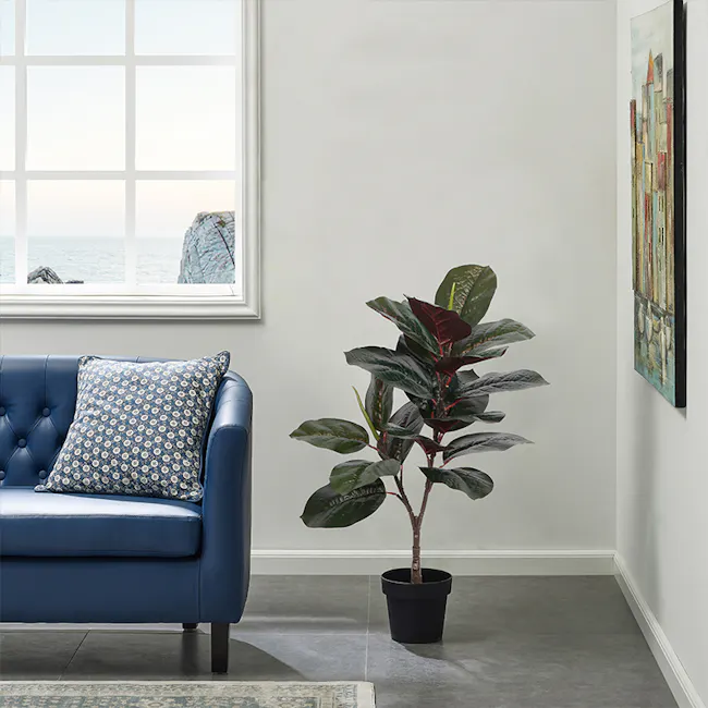 Potted Faux Dark Rubber Plant 70 cm - 4 - Blue tufted sofa, coastal view, large window, indoor plant, modern decor, abstract