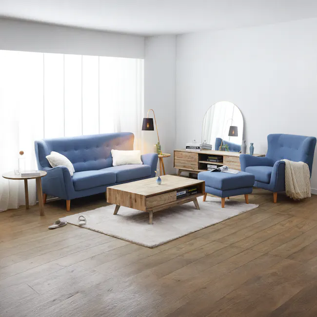 Jacob 3 Seater Sofa - Denim - 2 - Modern living room with blue tufted sofa, wooden coffee table, white fluffy rug, floor