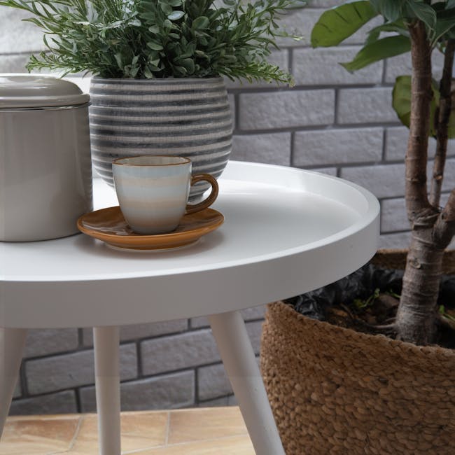 Aiko Queen Bed with Innis Side Table in White - 14 - White round table, minimalist decor, striped cup, brown saucer, potted