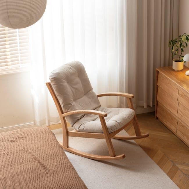 Kusa Rocking Lounge Chair with Ottoman - 14 - Sunlit room with beige chair, wooden dresser, sheer curtains, soft lighting