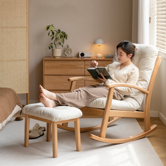 Kusa Rocking Lounge Chair with Ottoman - 3 - Wooden rocking chair, woman reading book, beige slippers, cozy room, indoor