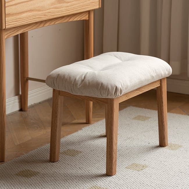 Kusa Rocking Lounge Chair with Ottoman - 15 - Light wooden stool, light beige cushion, natural wood legs, minimalist design