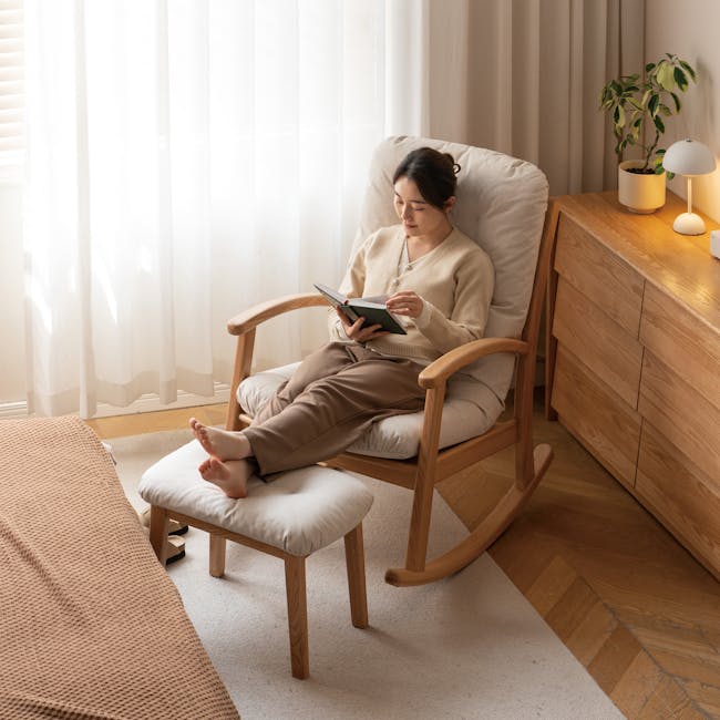 Kusa Rocking Lounge Chair with Ottoman - 2 - Light streaming through sheer curtains, cozy wooden chair, woman reading book