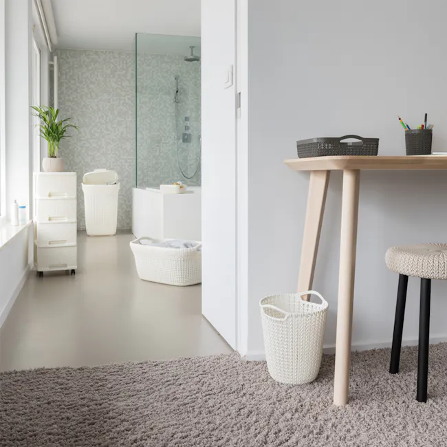 Knit Laundry Basket 40L - Oasis White - 4 - White bathroom with modern design, beige carpet, large window with green plant