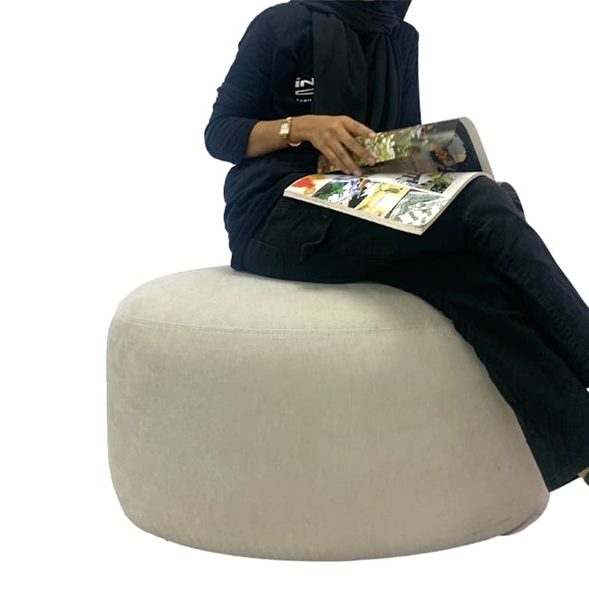 Pebble Ottoman - Thunder (2 Sizes) - 9 - black hoodie, black pants, magazine, sitting on bean bag, indoor setting, casual