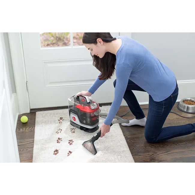 Hoover Clean Slate Corded Spot Cleaner - 3 - woman vacuuming, cleaning floor, pet litter, dog food bowl, tennis ball, white