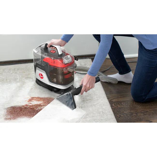 Hoover Clean Slate Corded Spot Cleaner - 2 - Vacuum cleaner, carpet cleaning, floor dusting, person kneeling, brown coffee