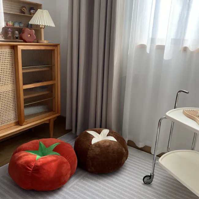 Mushroom Plush Cushion - 4 - Rustic wooden cabinet with glass doors and decorative items, Two plush, round, red and brown