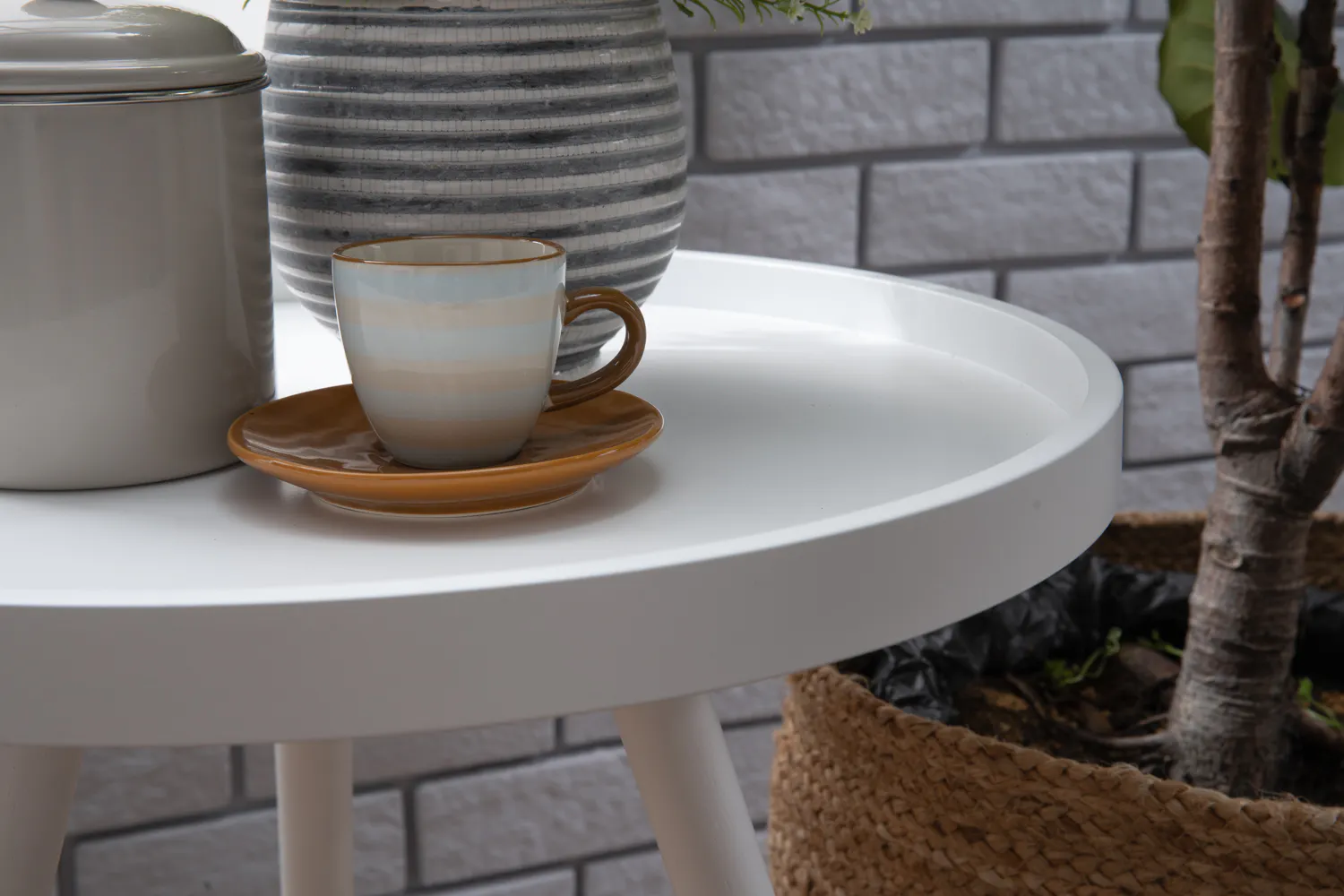 Innis Side Table - White, Natural - 13 - White round table, minimalist decor, striped cup, brown saucer, potted plant, gray