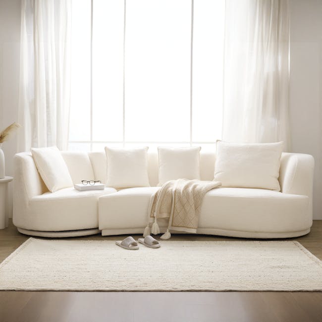 Holly 3 Seater Swivel Sofa - Beige - 2 - Creamy white, cozy living room, soft lighting, plush sofa, white pillows, modern
