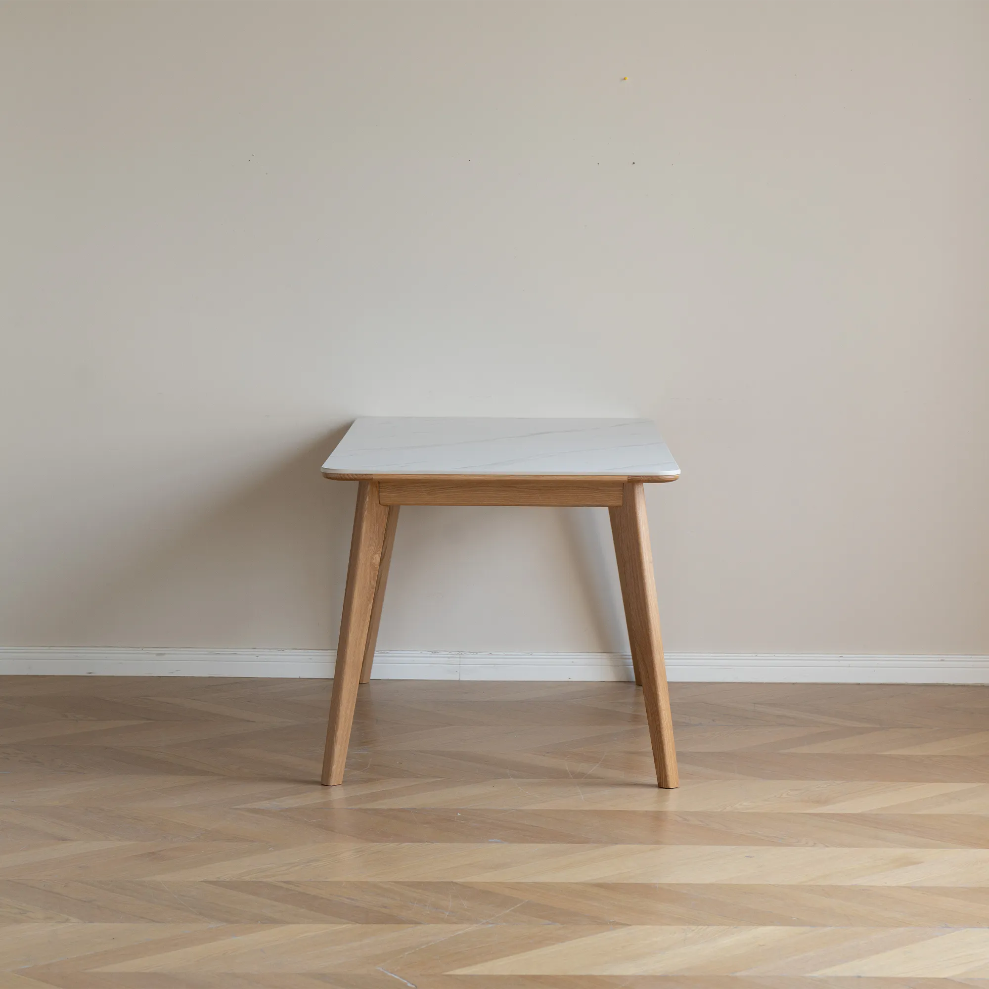 Nellie Dining Table 1.4m - Oak (Sintered Stone) - 20 - White marble tabletop, wooden legs, light beige wall, minimalist